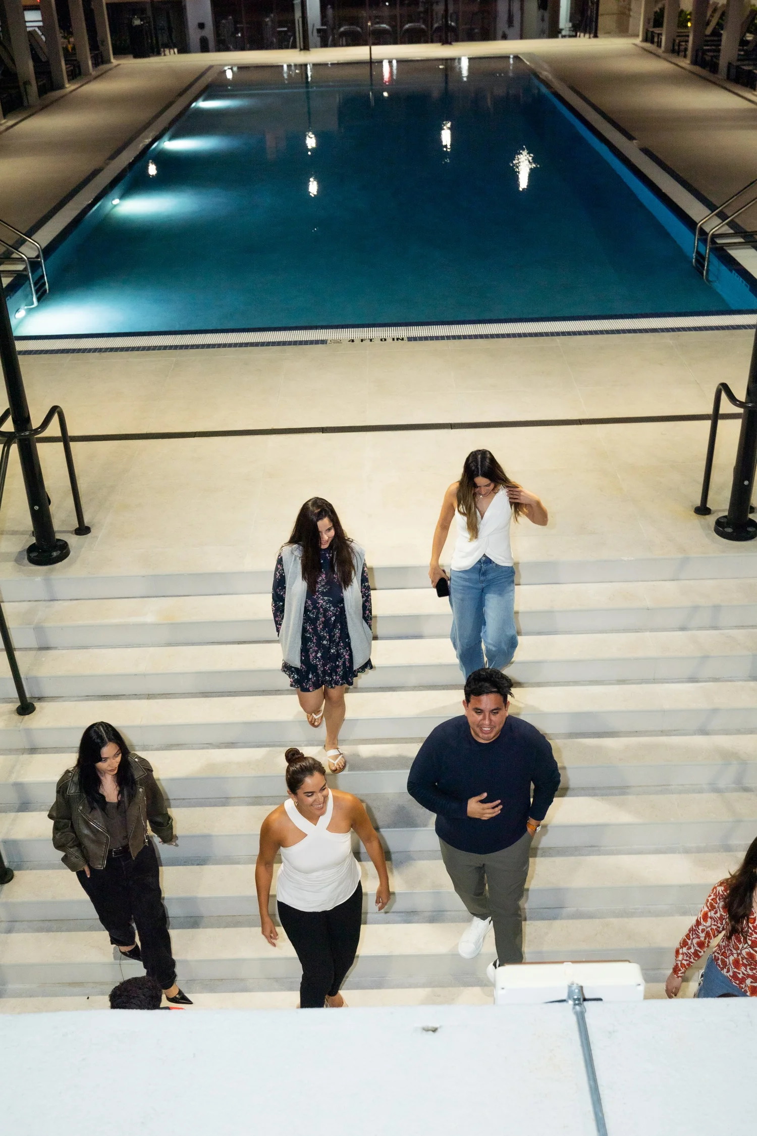 Members of the By Casa Grace community together on the steps
