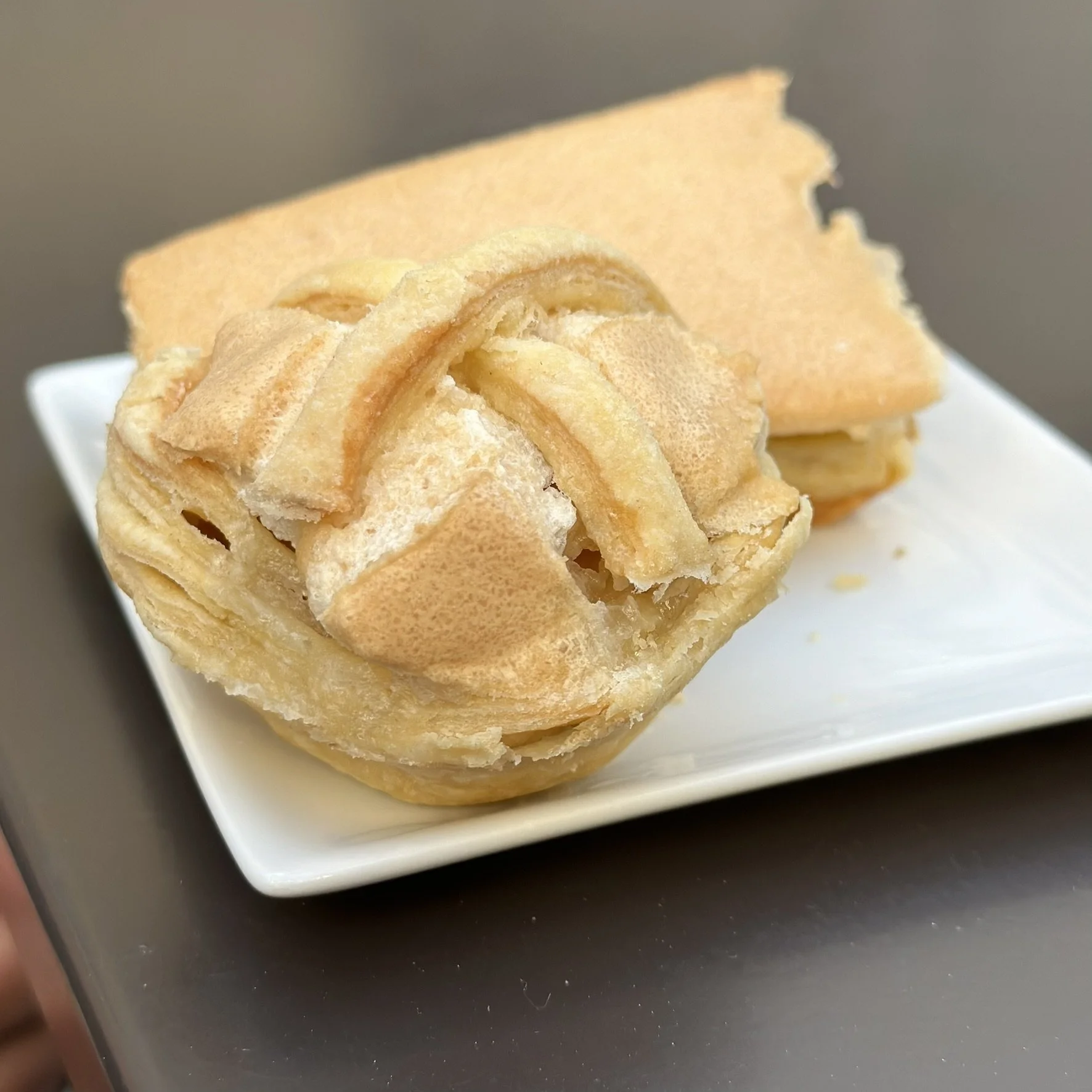 A sweet stop at Confeitaria Moura—Jesuíta pastry and a bright lemon treat..
