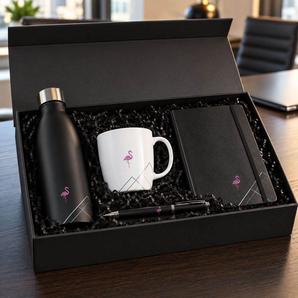 Branded bottle, mug, notebook and pen presented together in a gift set