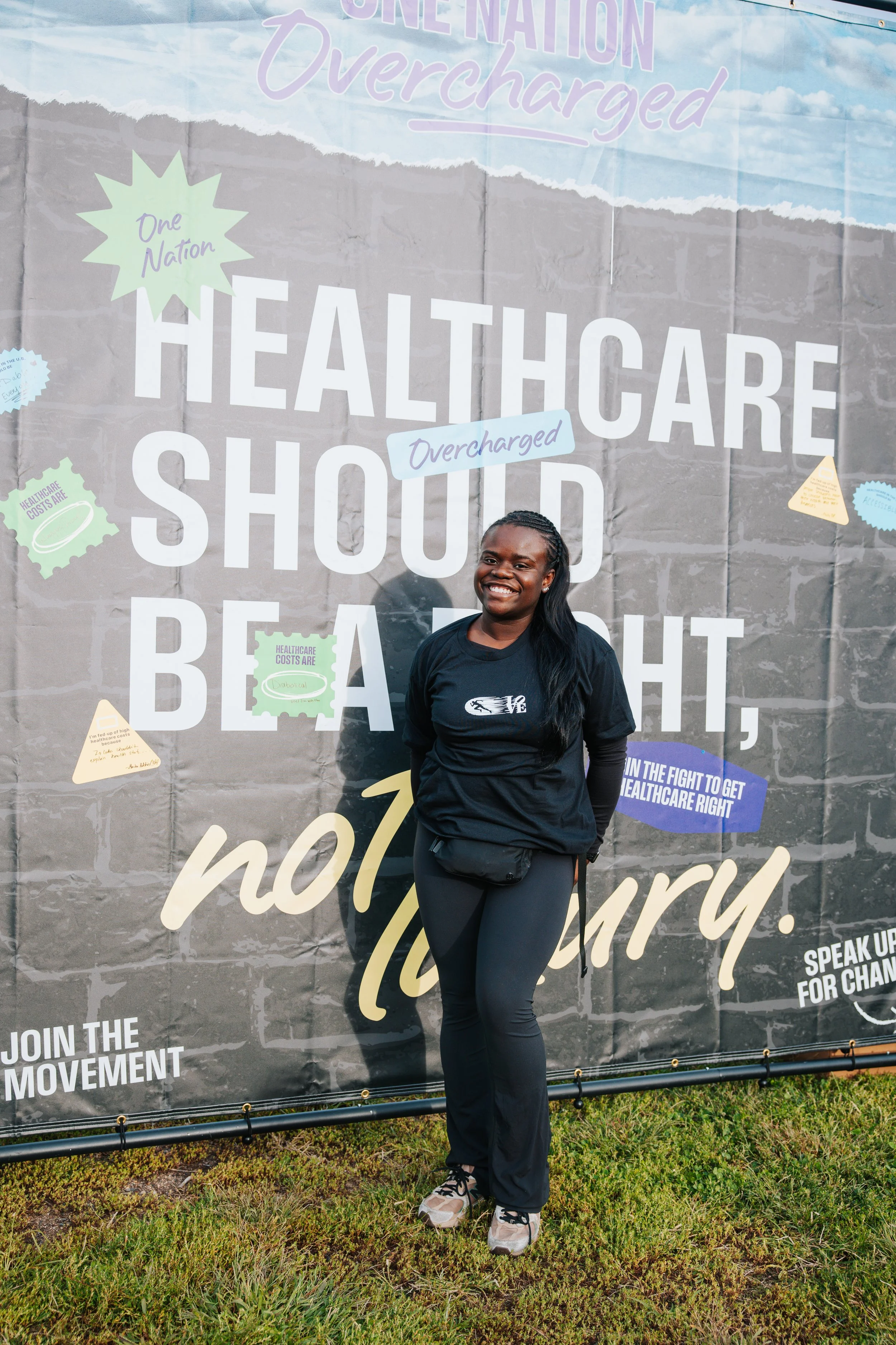 Community Member in Front of Healthcare Should Be a Right Sign
