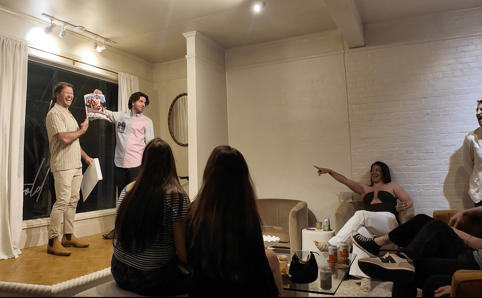 Ben Travelyn performing a parlor magic show for a seated group