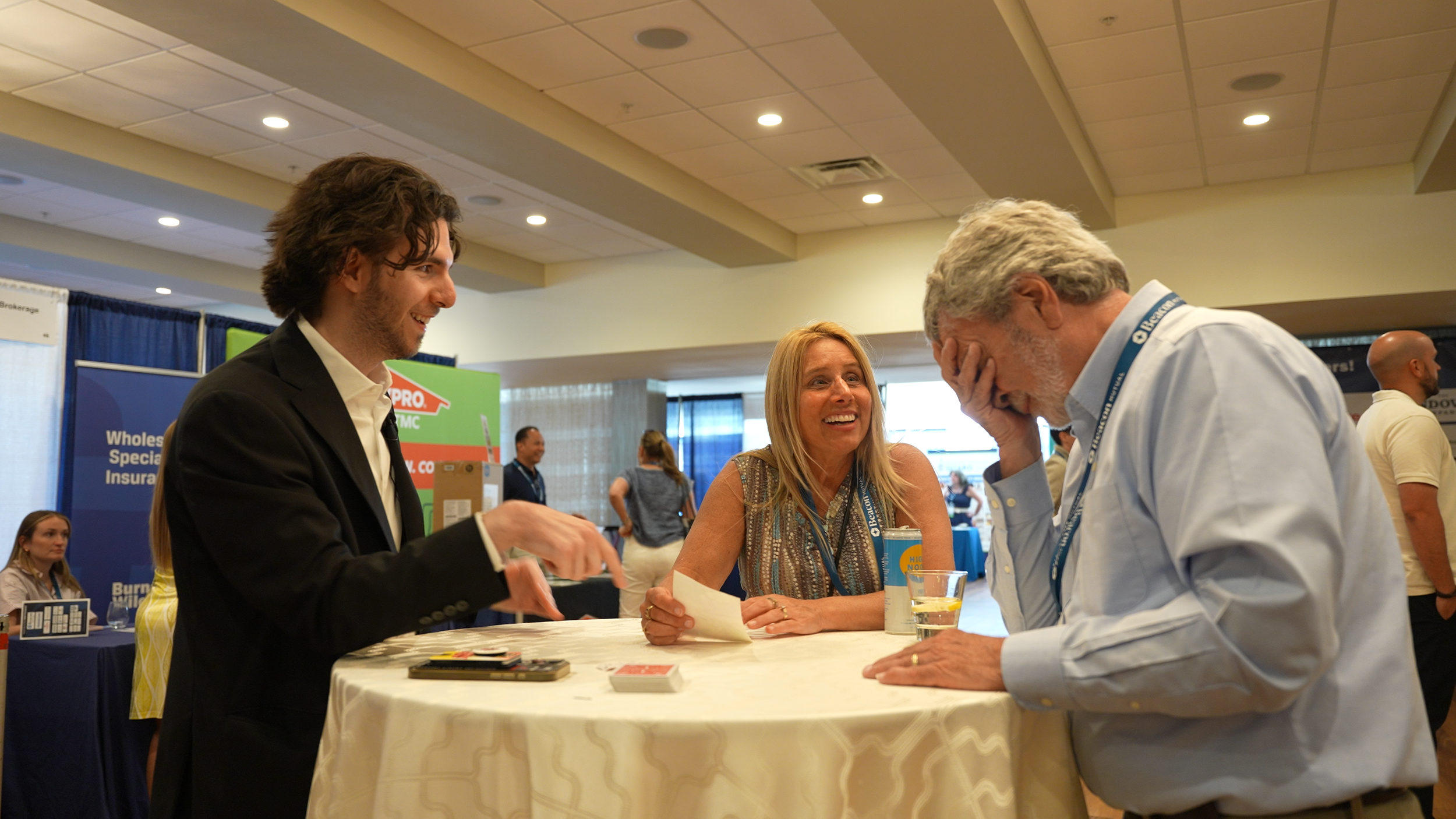 Ben Travelyn performing close-up magic for guests at a New England event