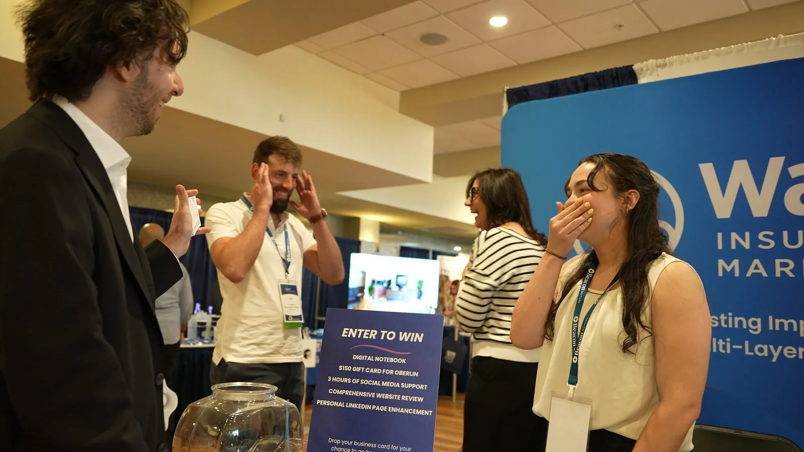 Trade show attendee reacting in shock to a close-up magic trick at an exhibitor booth