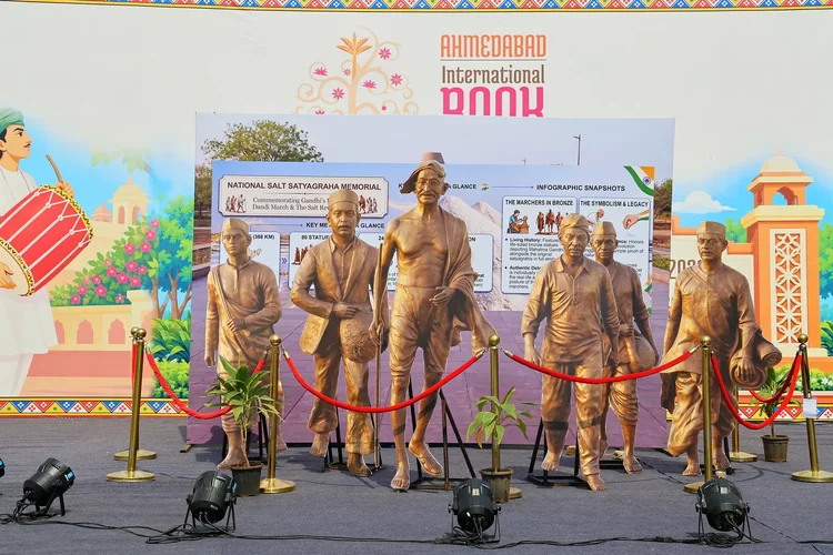 Bronze statues of the Dandi March displayed at the festival grounds