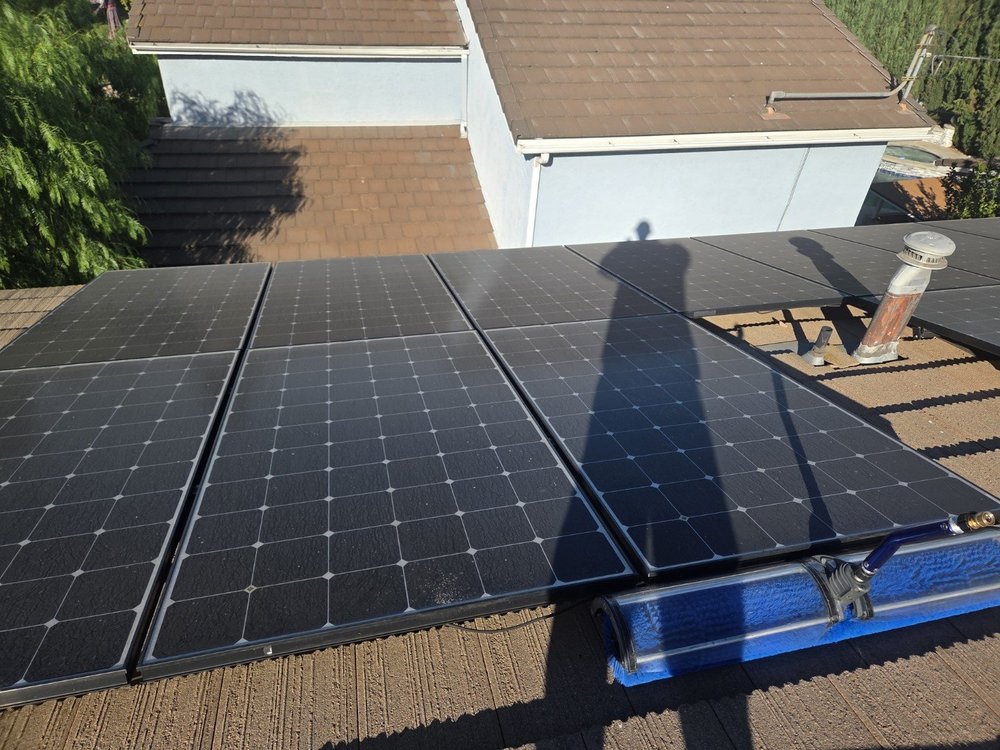 Tile-roof solar panels with visible surface buildup