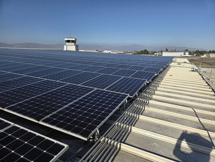 Rows of commercial rooftop solar panels after cleaning