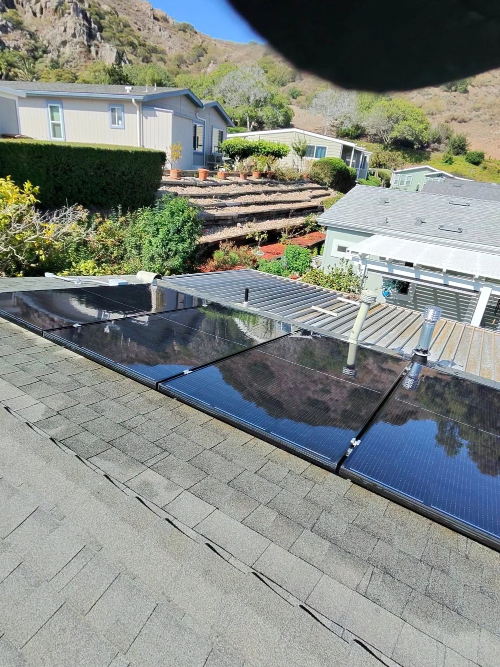 Cleaned panels on a low-slope residential roof in the Camarillo–Oxnard area