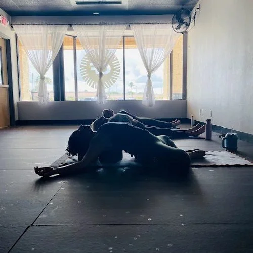 A class resting on their mats at Central Florida Power Yoga