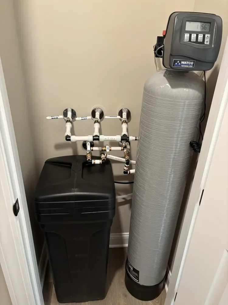 1.5 cubic foot Watco water softener with brine tank and labeled Water Main, Hose Bibs and House valves, installed by Jaden in Westfield