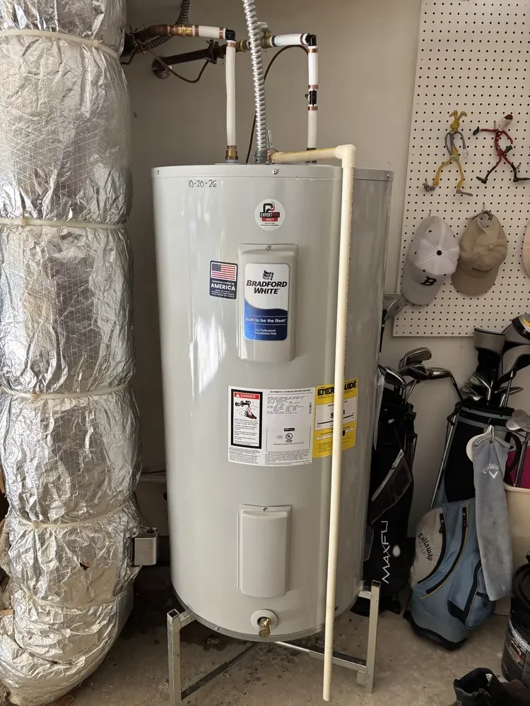 New Bradford White 50-gallon electric water heater installed by Jaden in a Fishers, IN garage, dated 10-20-26