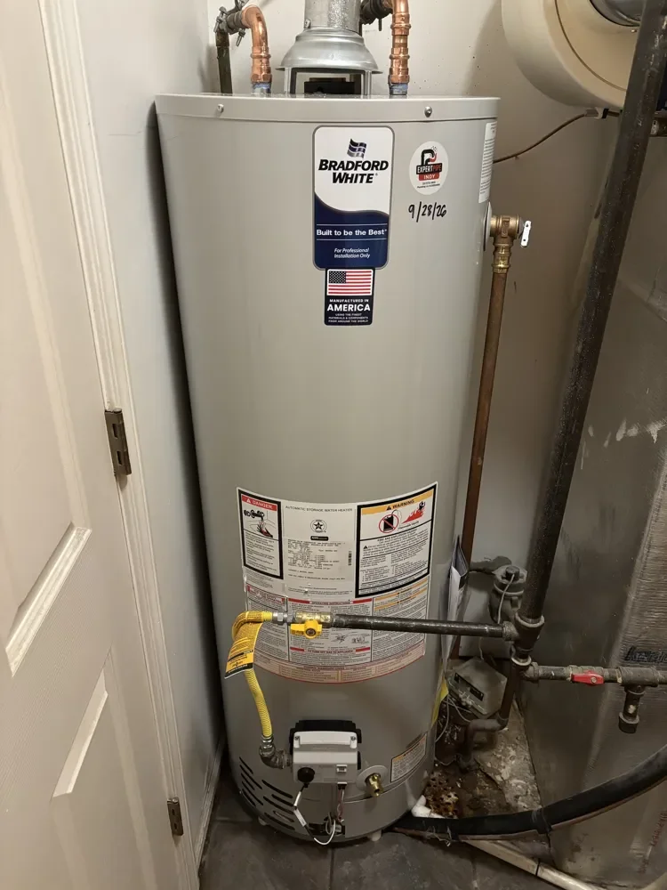 New Bradford White gas water heater with copper connections and yellow gas flex line installed by Jaden in Westfield, dated 9/28/26