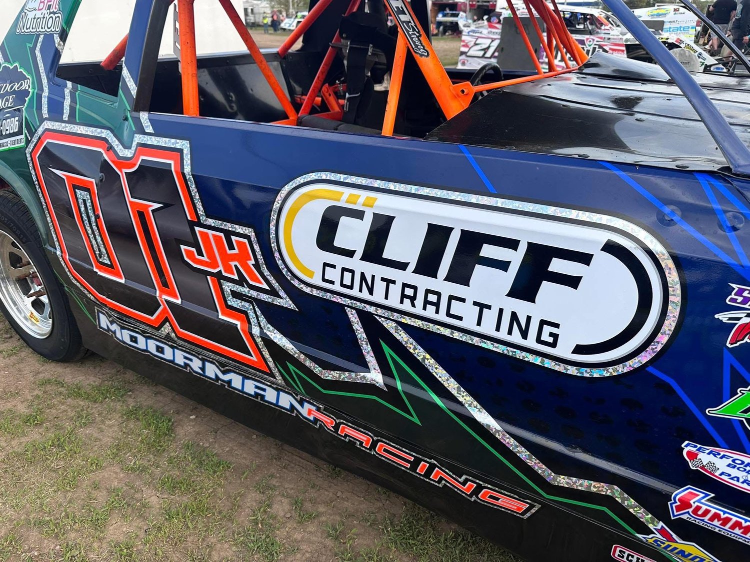 Cliff Contracting logo displayed on a sponsored race car