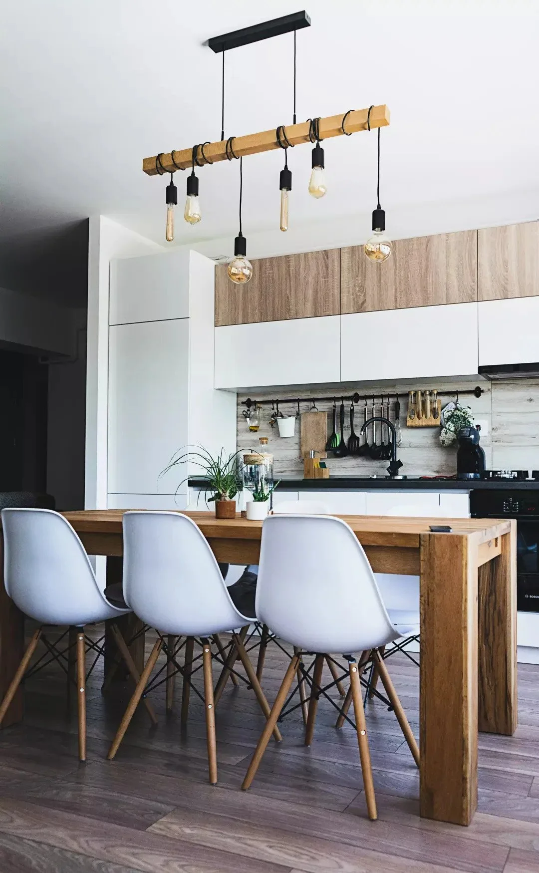 Dining and kitchen area showcasing smooth wall finishes