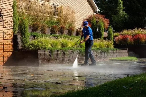 Stone and paver patio being cleaned