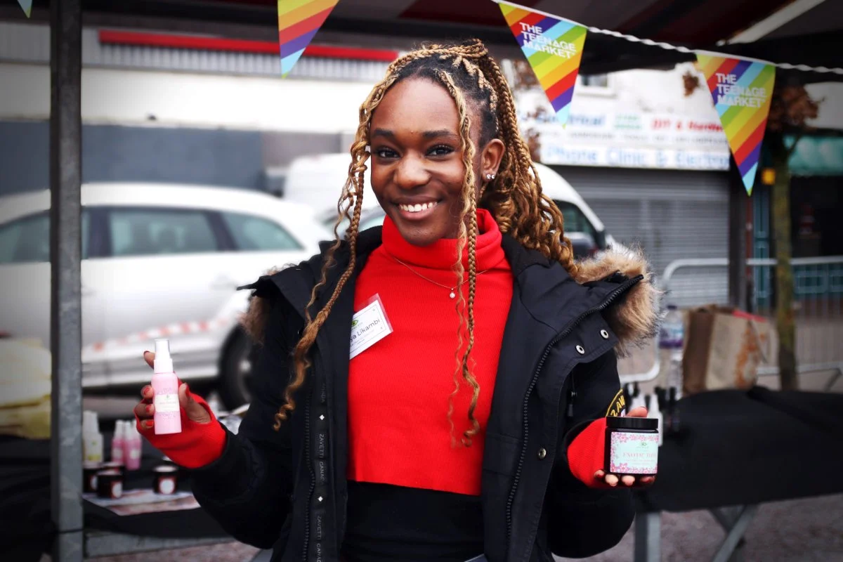 Latoya with her skincare products