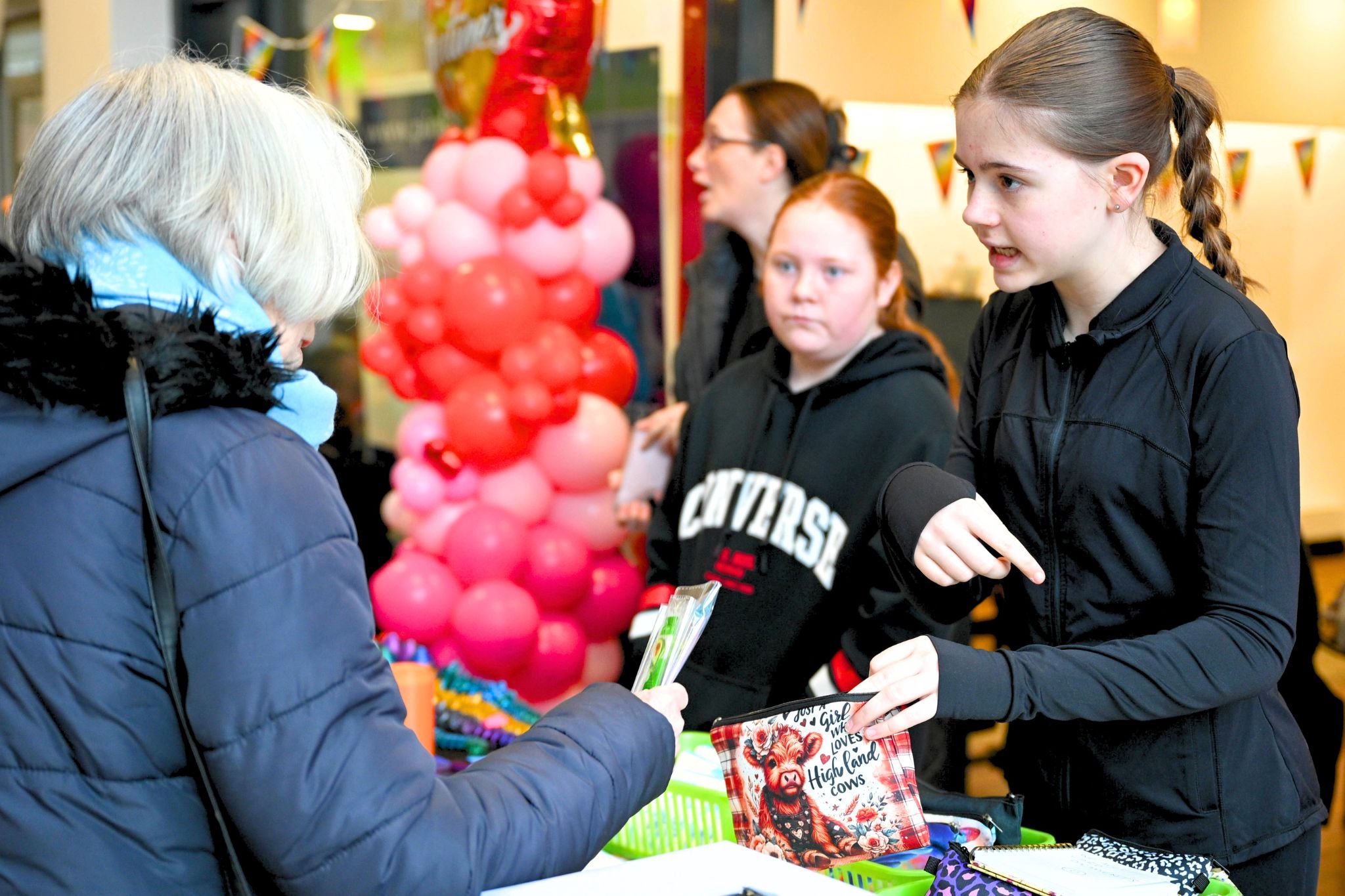 Young trader and visitor at Poulton Teenage Market