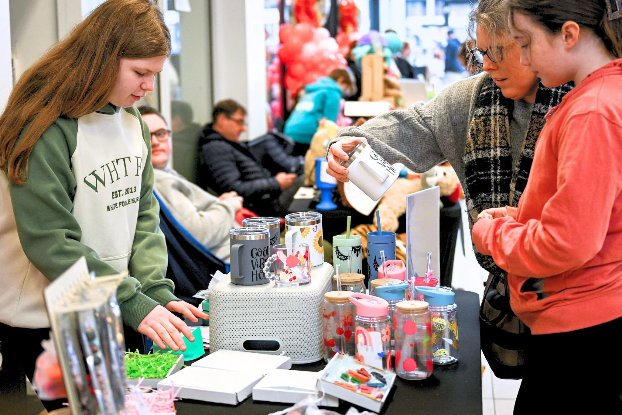 Young entrepreneurs and visitors at Teanlowe Shopping Centre