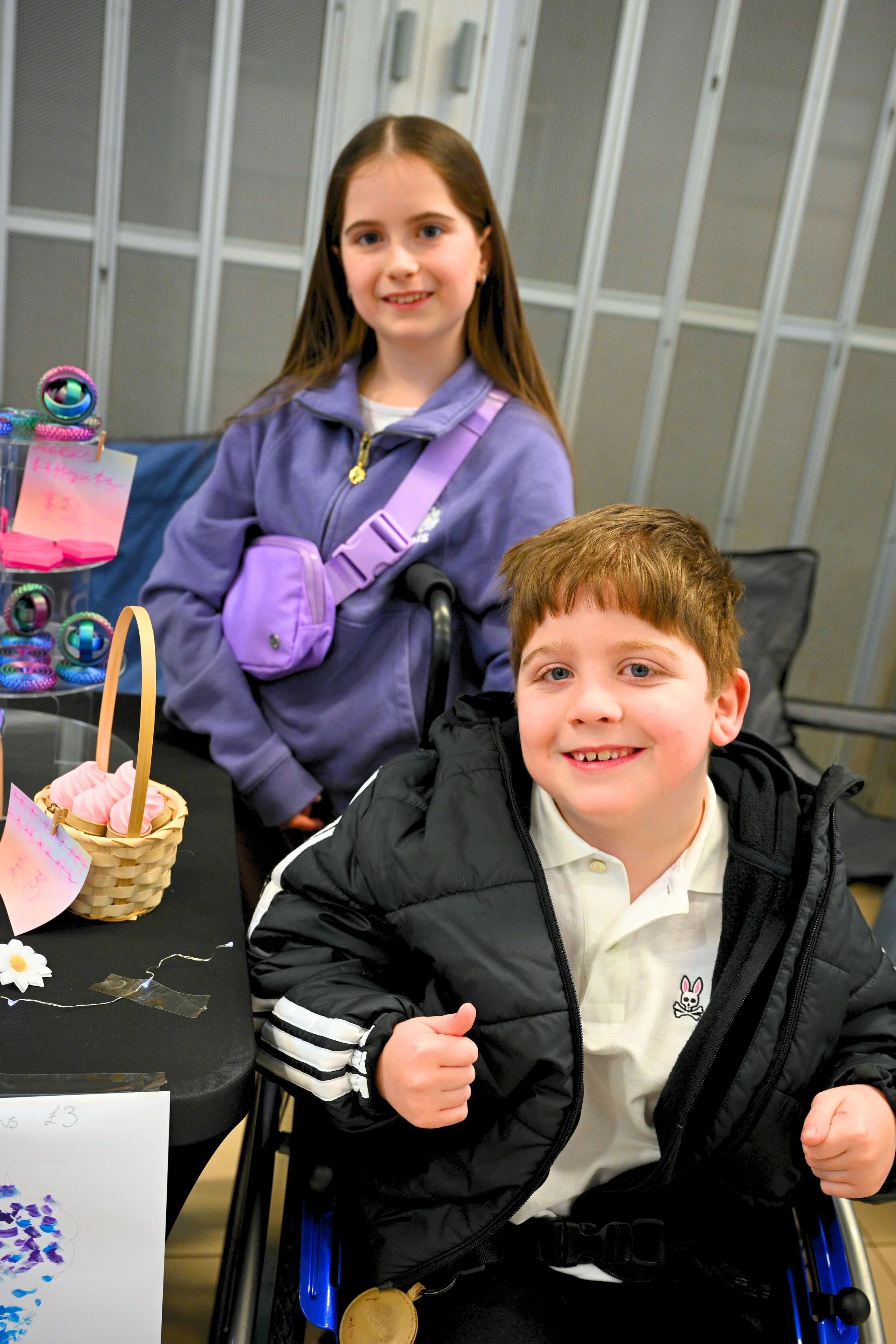 Visitors browsing young trader stalls at Teanlowe Shopping Centre