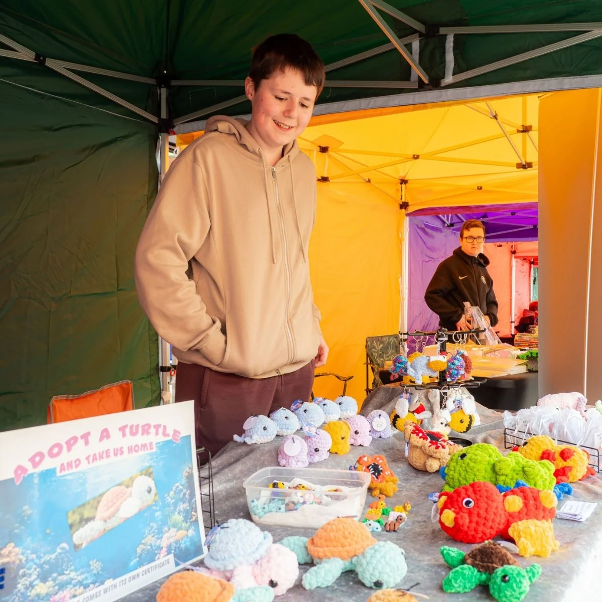 Young trader with crocheted products at the Nuneaton Teenage Market
