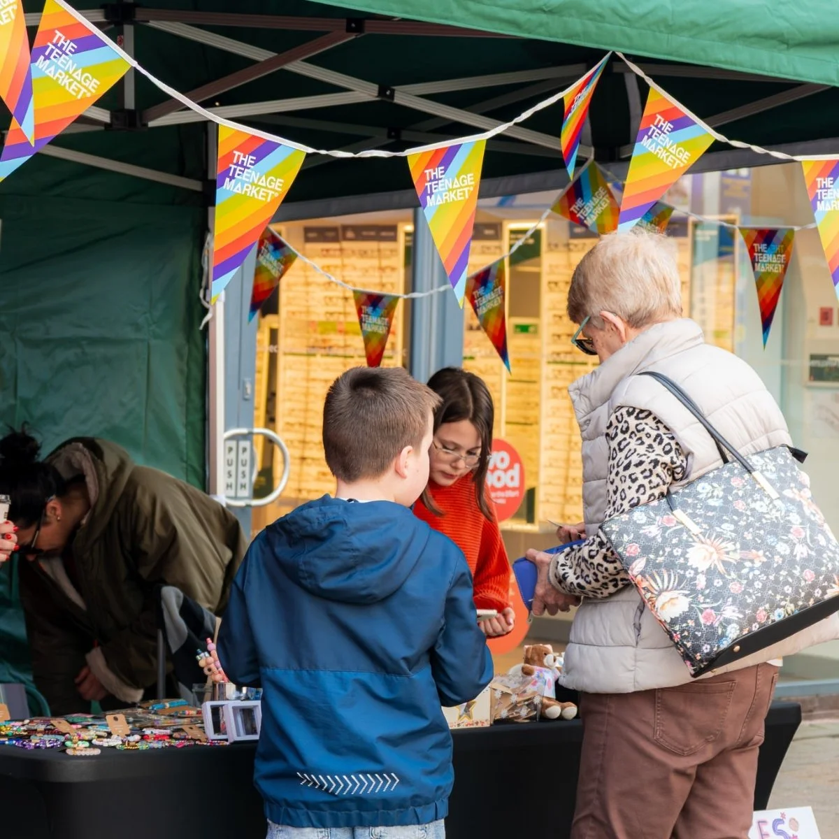 Young traders speaking with customers at the Nuneaton Teenage Market