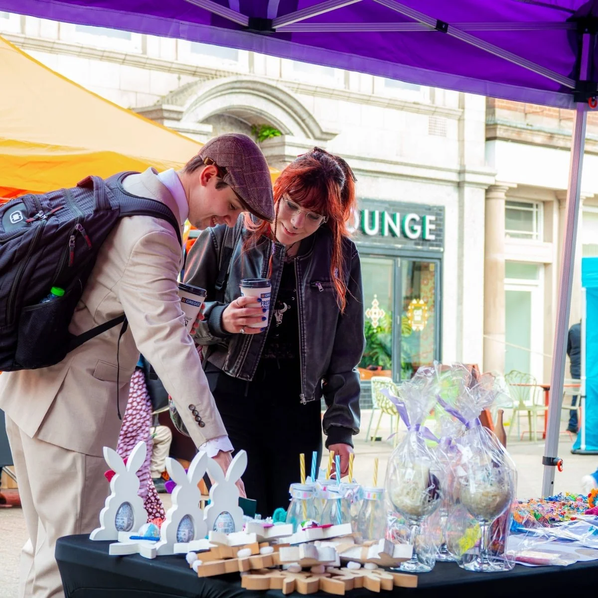 Visitors browsing a young trader’s stall in Nuneaton