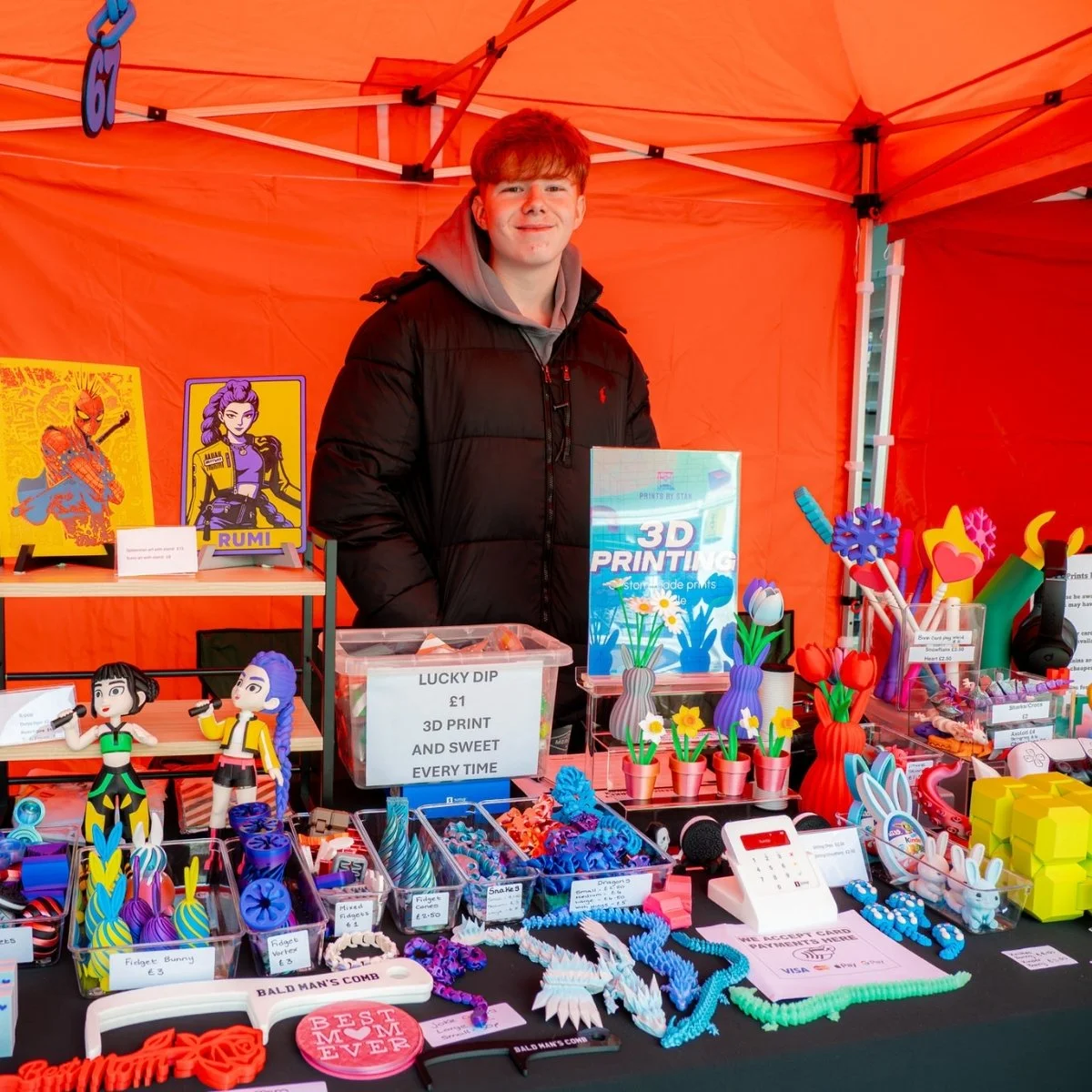 Young trader with 3D printed products at the Nuneaton Teenage Market