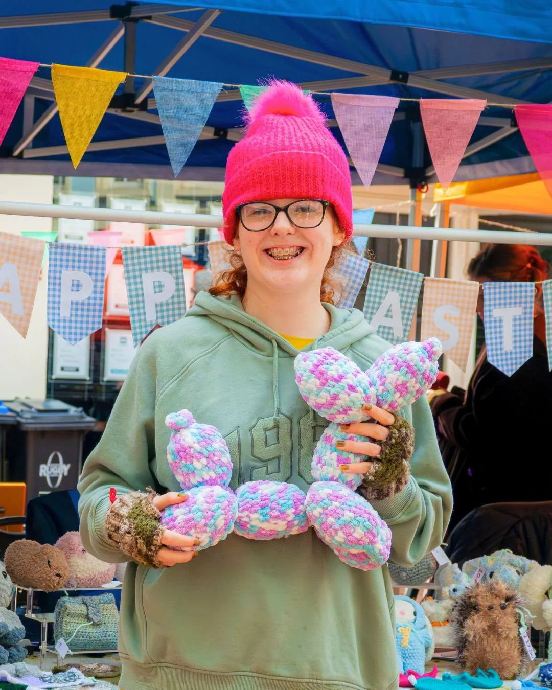 Young trader displaying products at the Rugby Teenage Market