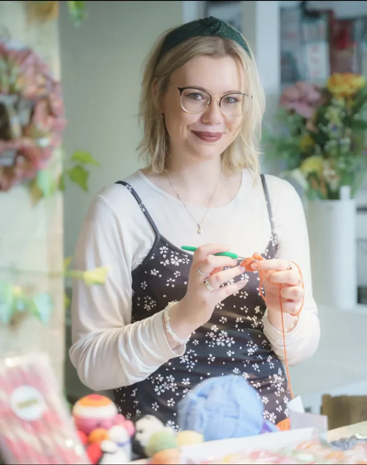 Kellie with her crochet creations