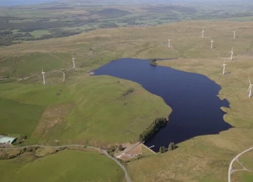 Aerial view of Penwhapple Reservoir and surrounding wind turbines during a Northpoint site investigation project