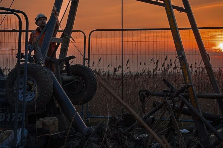 Northpoint engineer supervising cable percussion drilling during a Phase 2 ground investigation to assess geotechnical soil conditions.