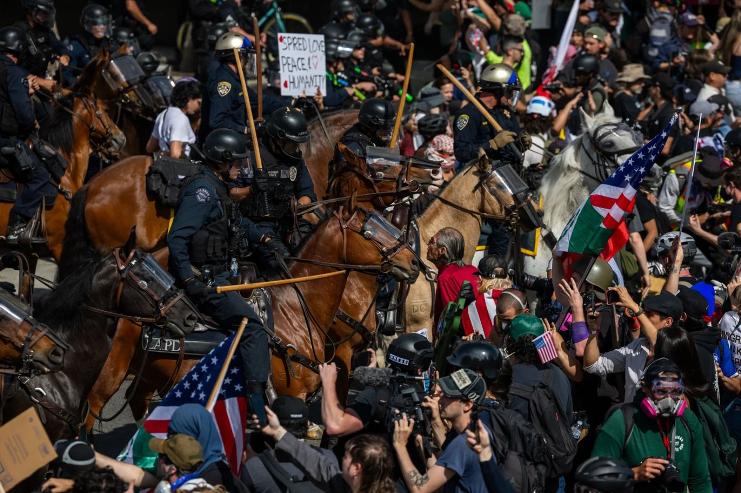 Photo: Ethan Swope Mounted police officers push into a crowd of protesters. Documentary photograph by Ethan Swope.