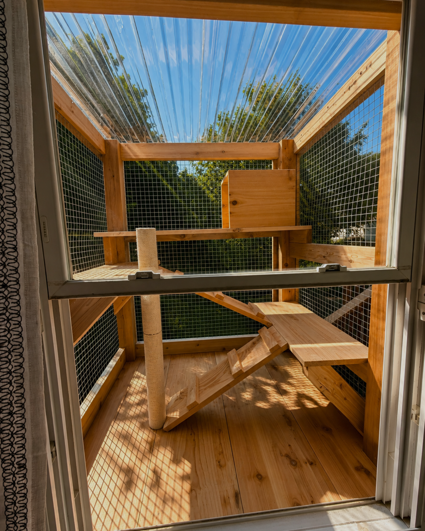 Cedar window box catio accessed through a window, built by Monument Catios