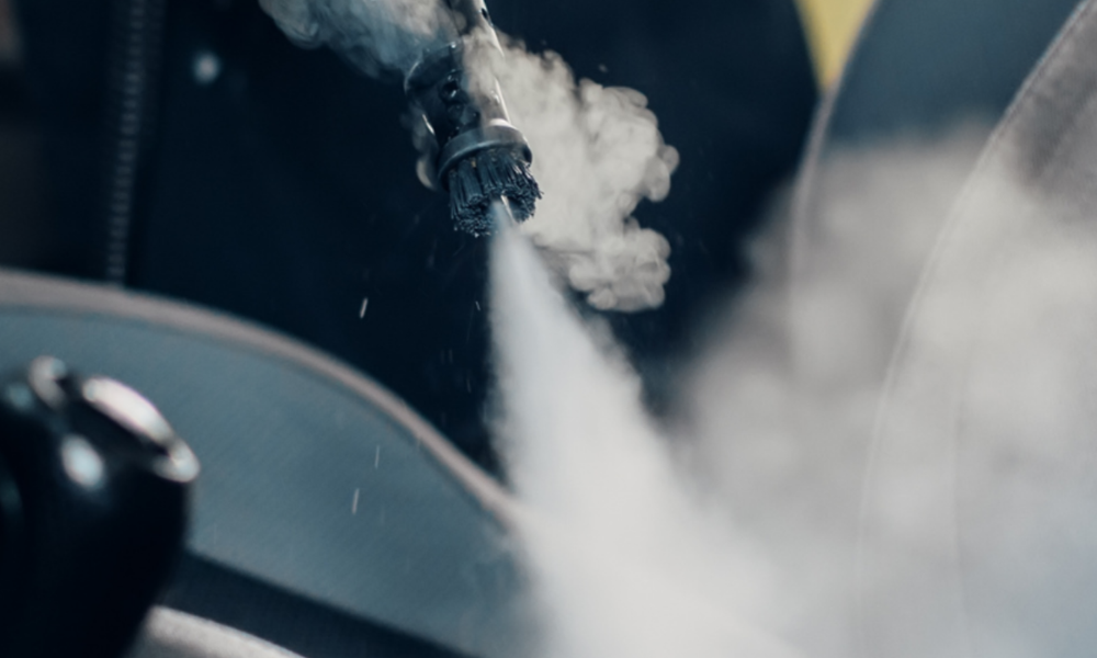Steam cleaning high-touch interior surfaces