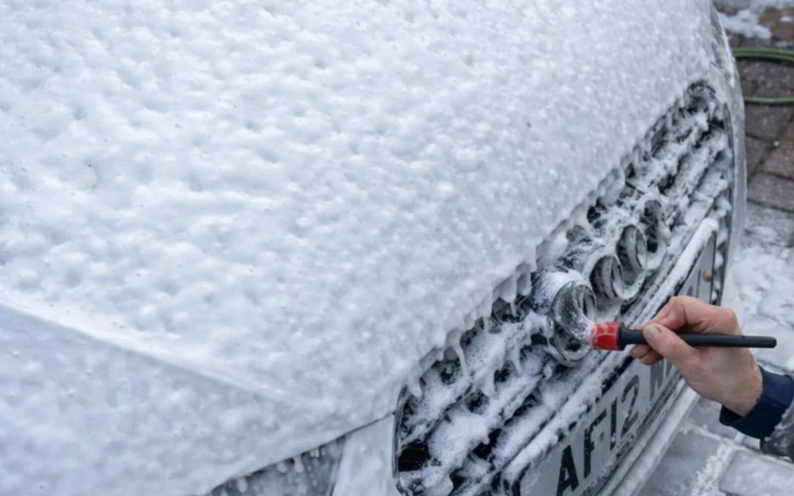 Detailed exterior clean with brushes on trims and crevices