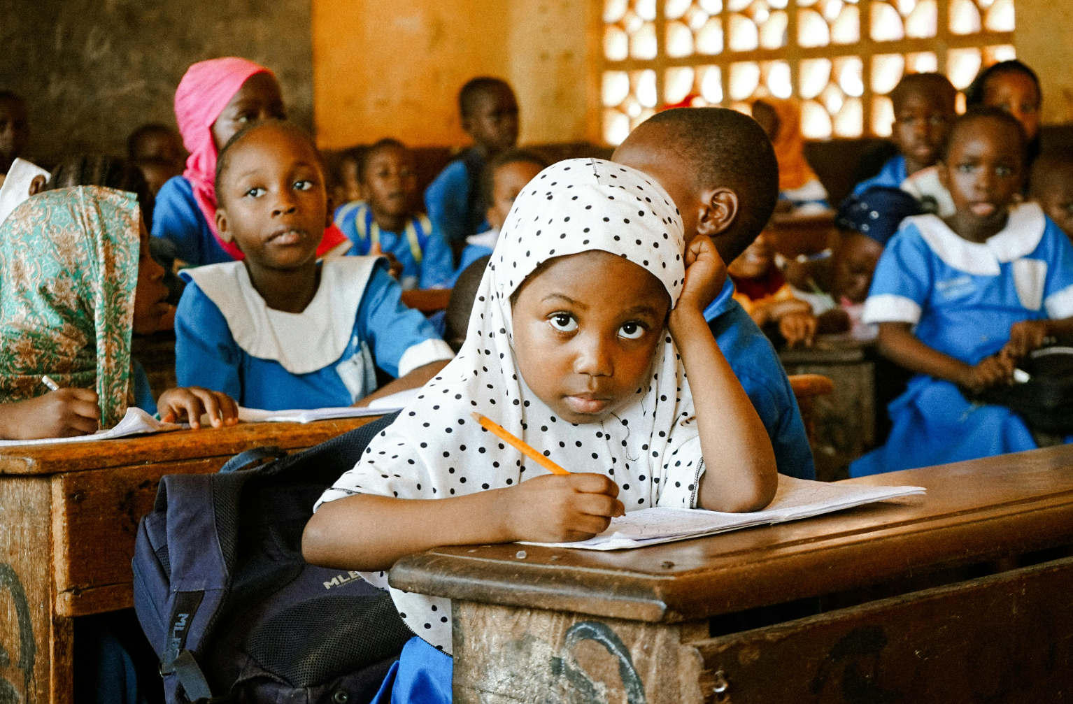 Children in classroom learning together