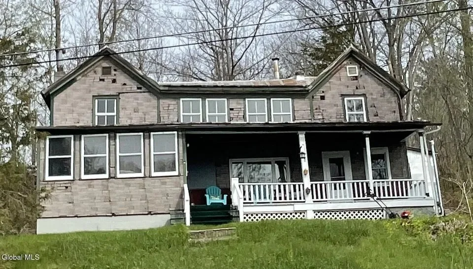 Exterior and front porch of the sold home at 523 Enders Avenue in Howes Cave, New York