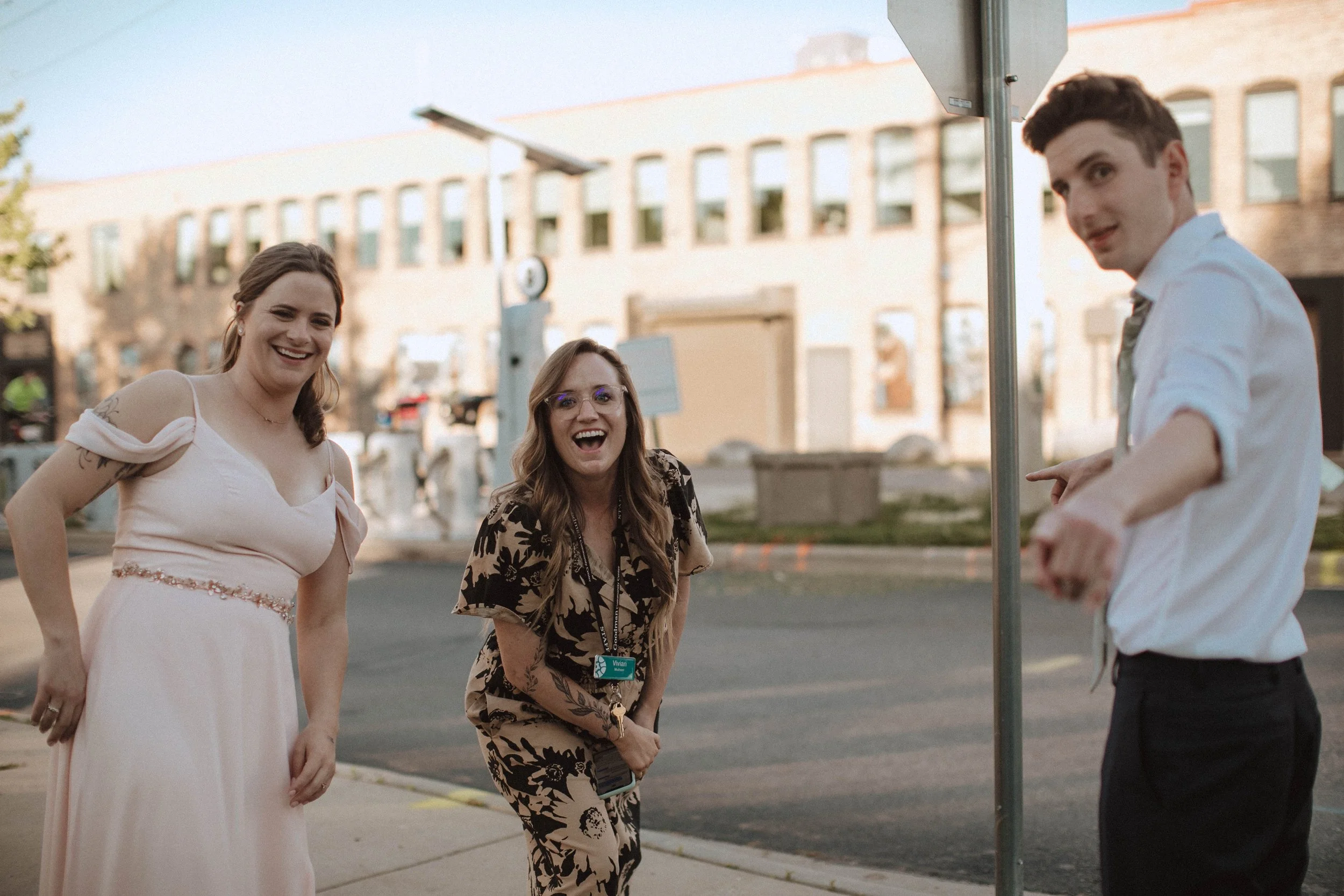 Vivian laughing with clients on their wedding day