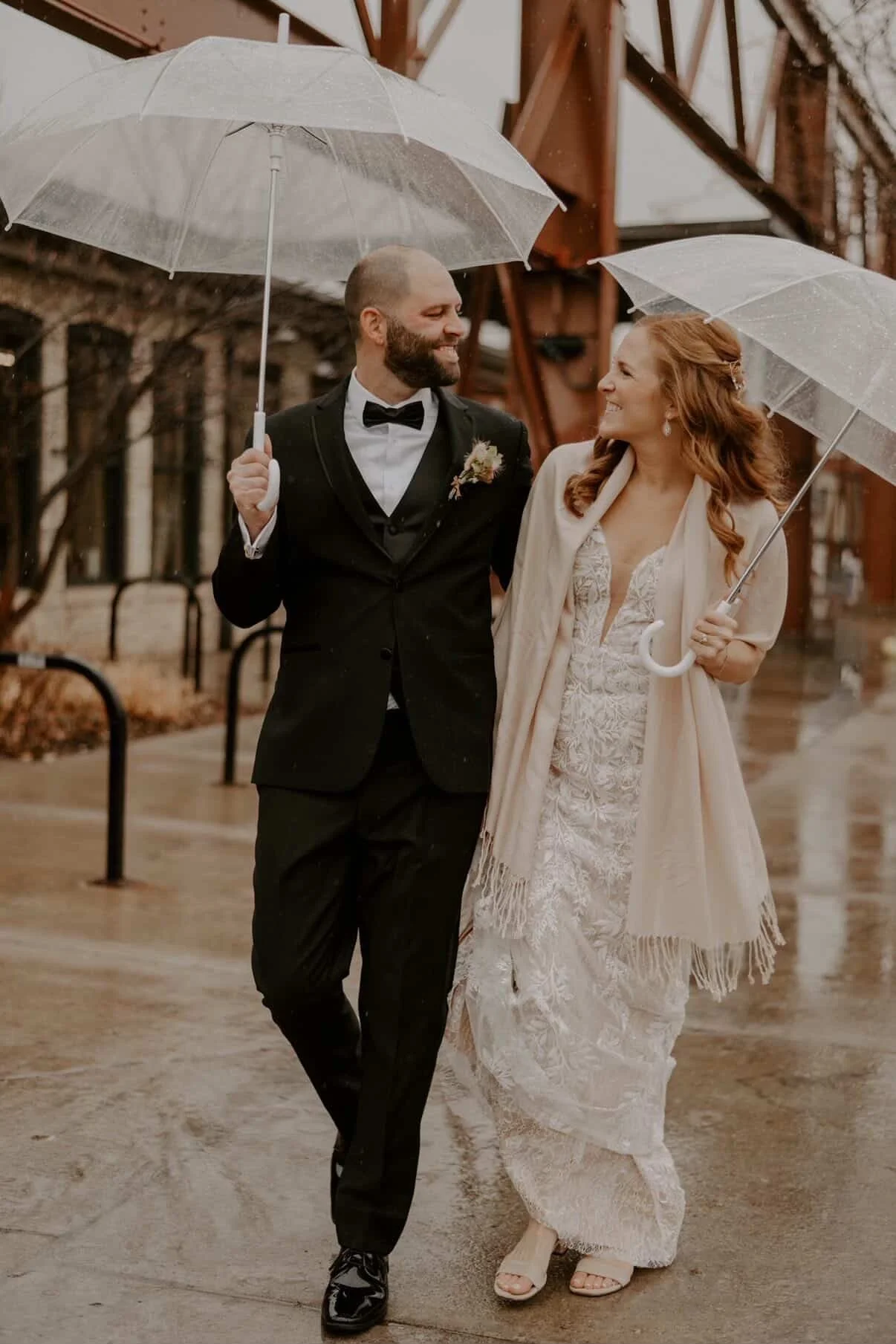 A couple under umbrellas in the rain