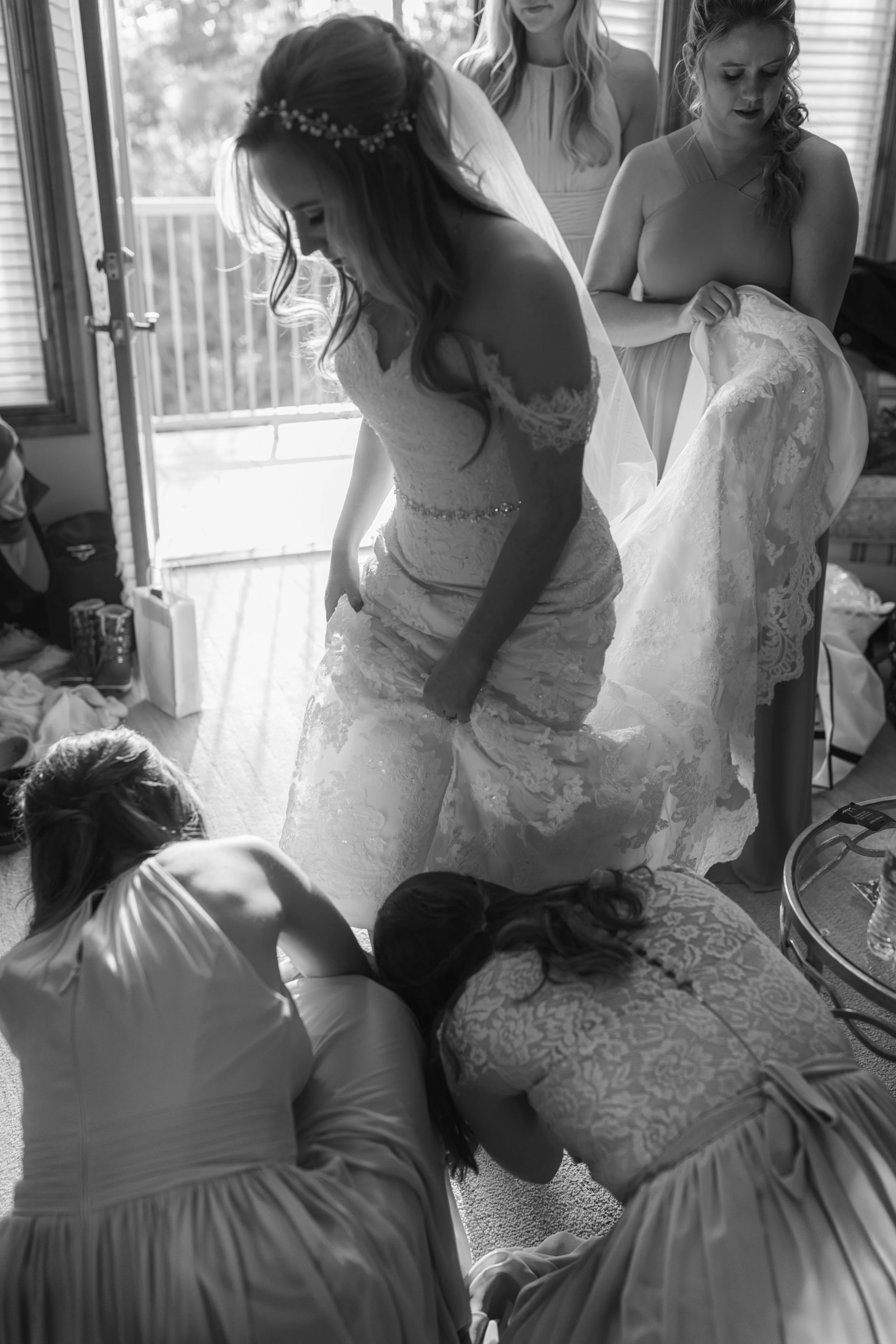 A black and white portrait of a bride in a quiet moment