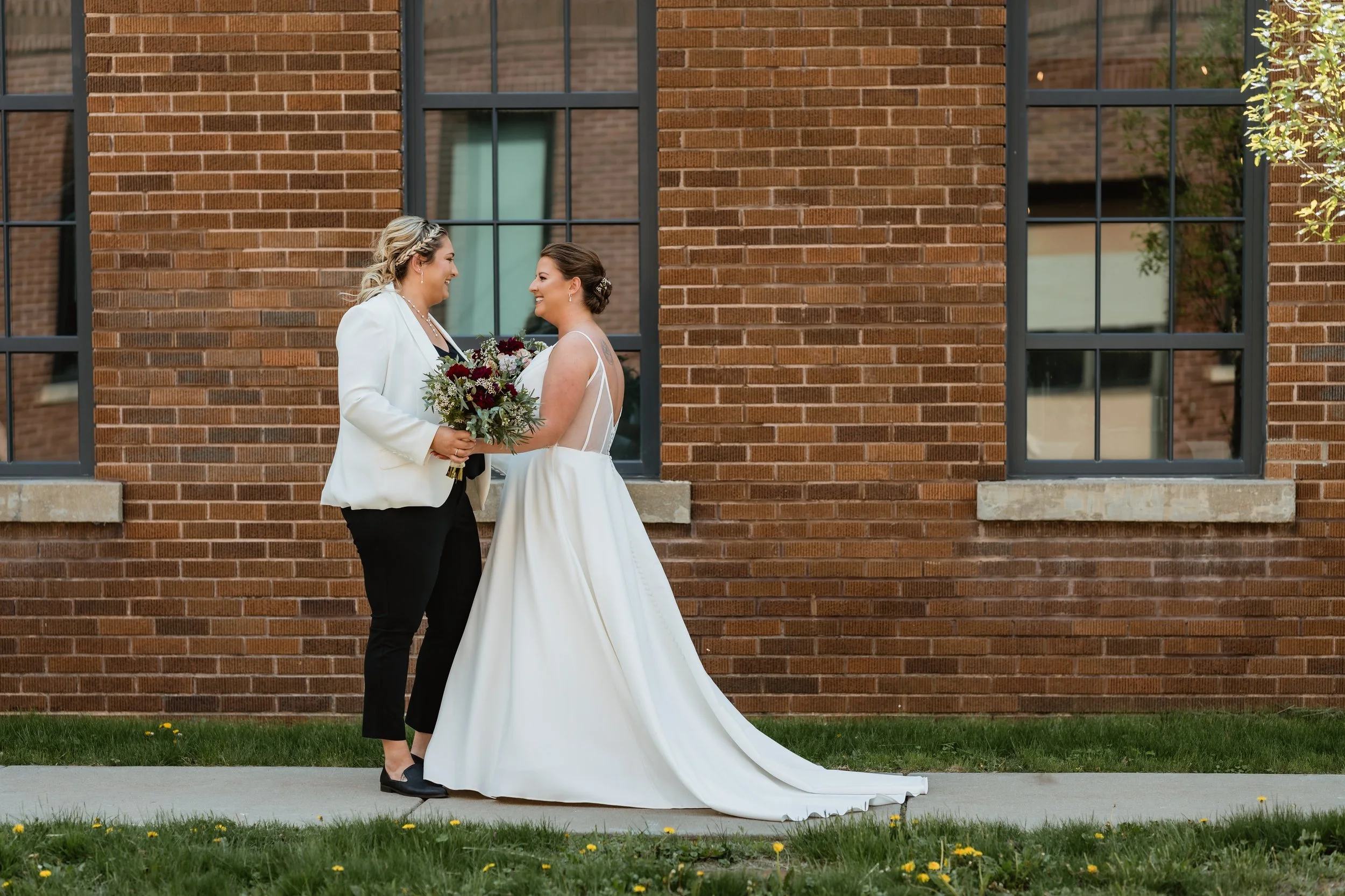 Bride outside brick building
