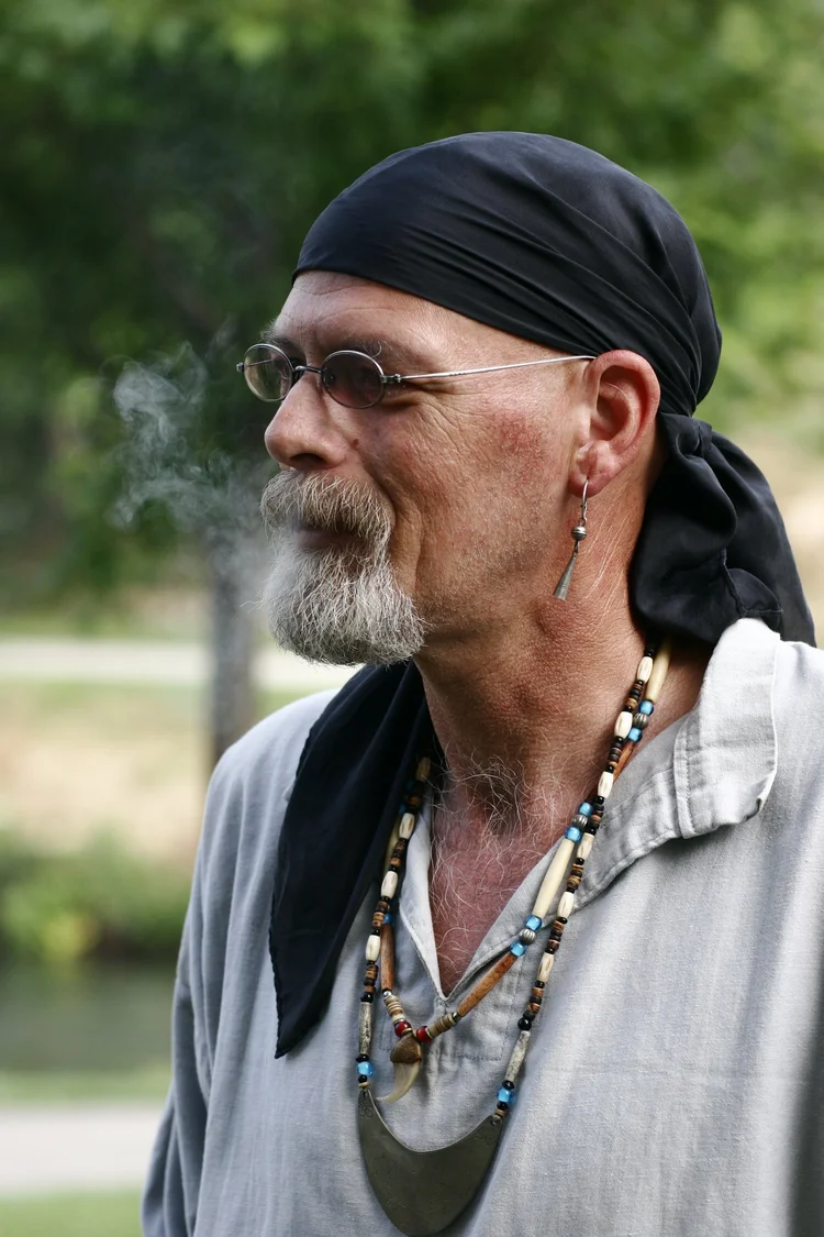 Man in a bandana and beads