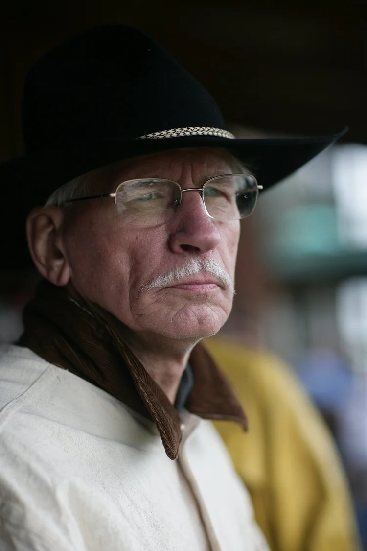 Older man in a black hat and glasses