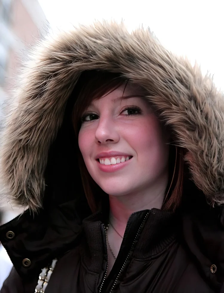Young woman in a fur-lined hood