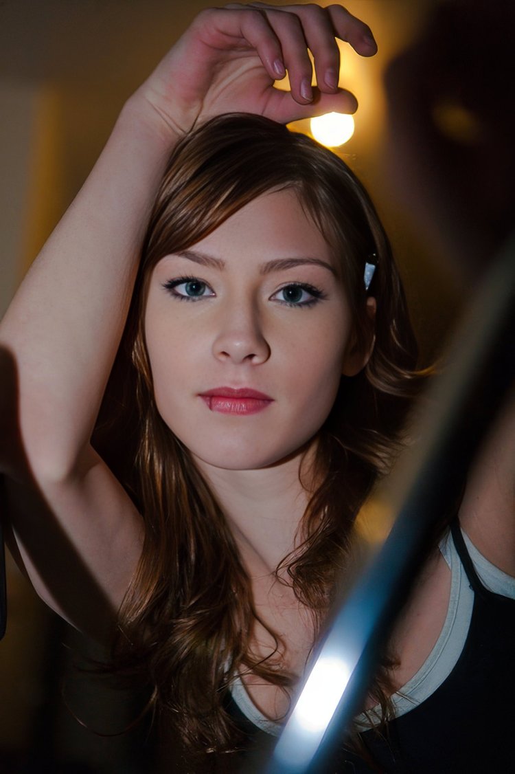 Young woman under a warm light