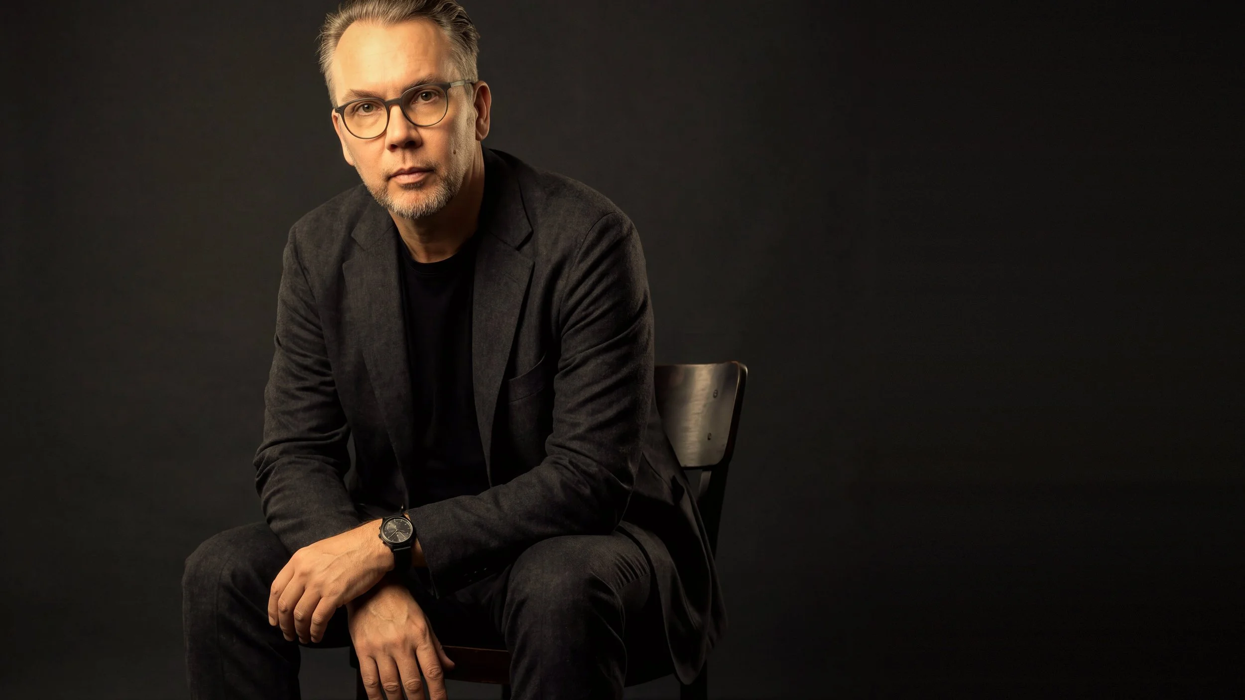 Michael Bell, seated in the s’gpor studio in La Crosse