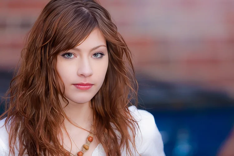 Young woman with long auburn hair