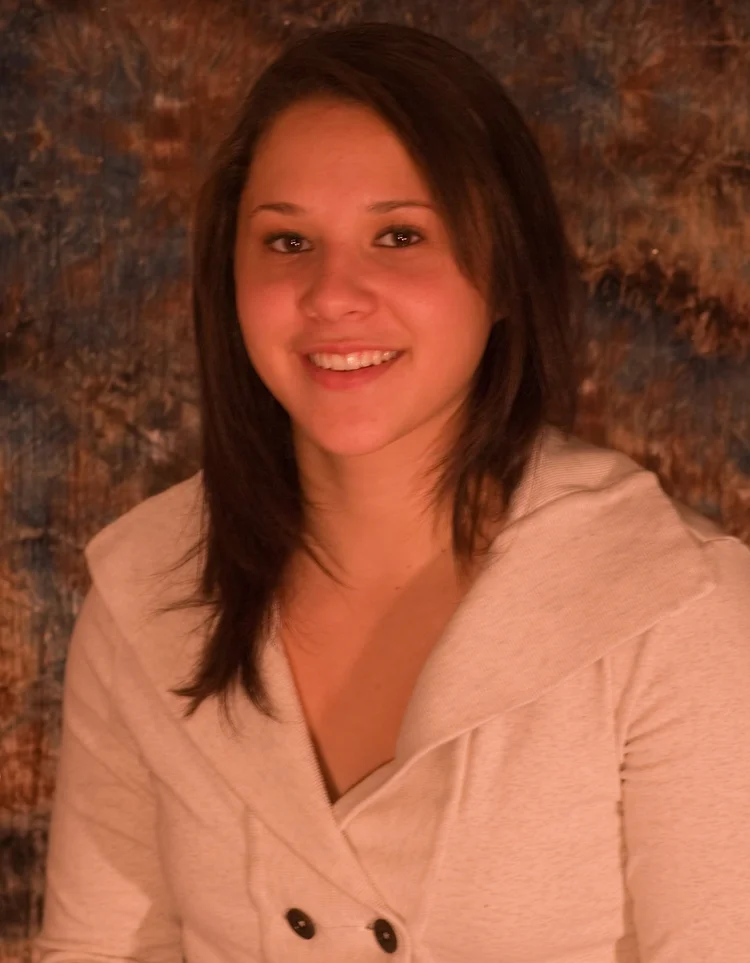 Young woman smiling, warm tones