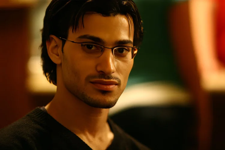 Young man with glasses in warm light
