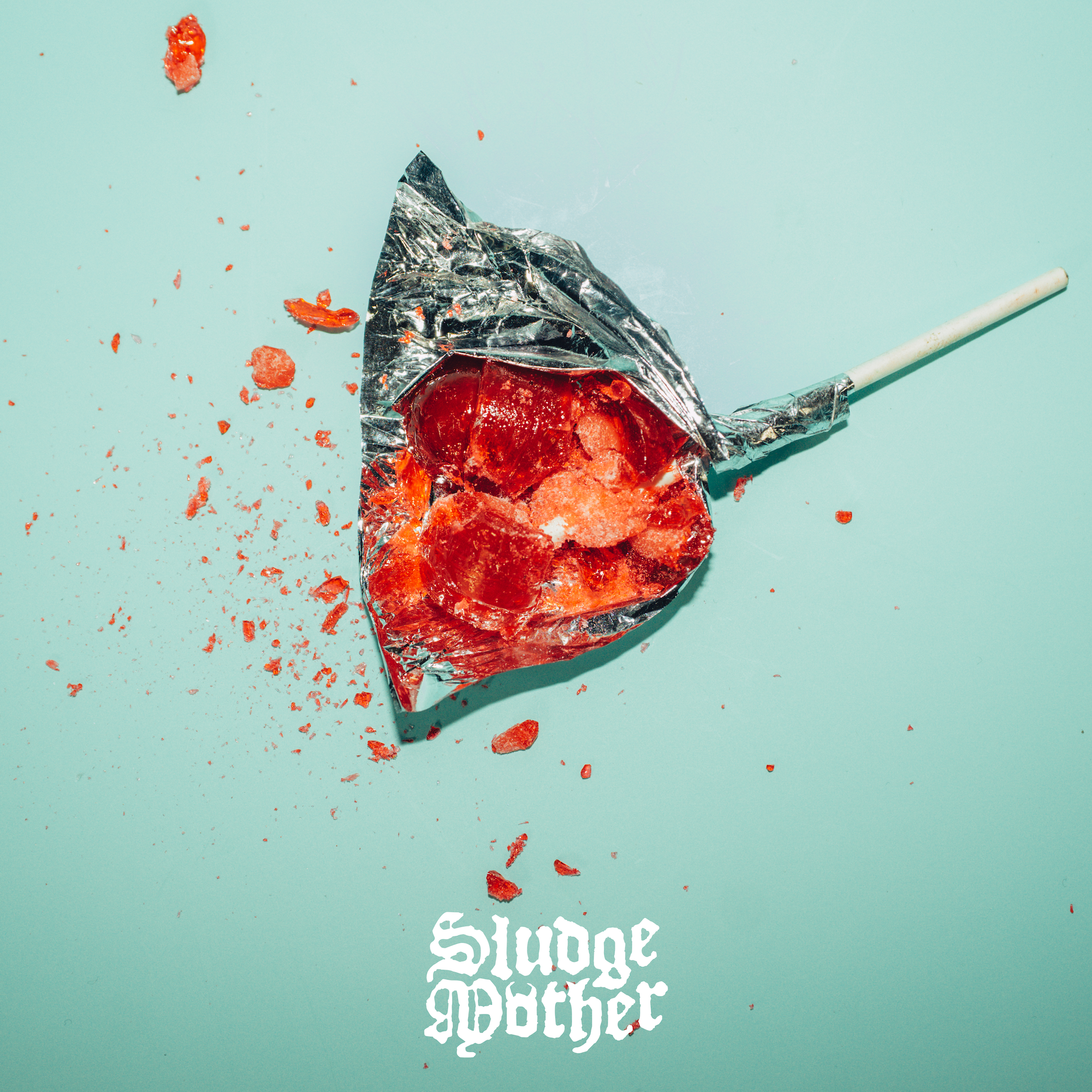 Feed Me single cover: a smashed red lollipop on pool mint