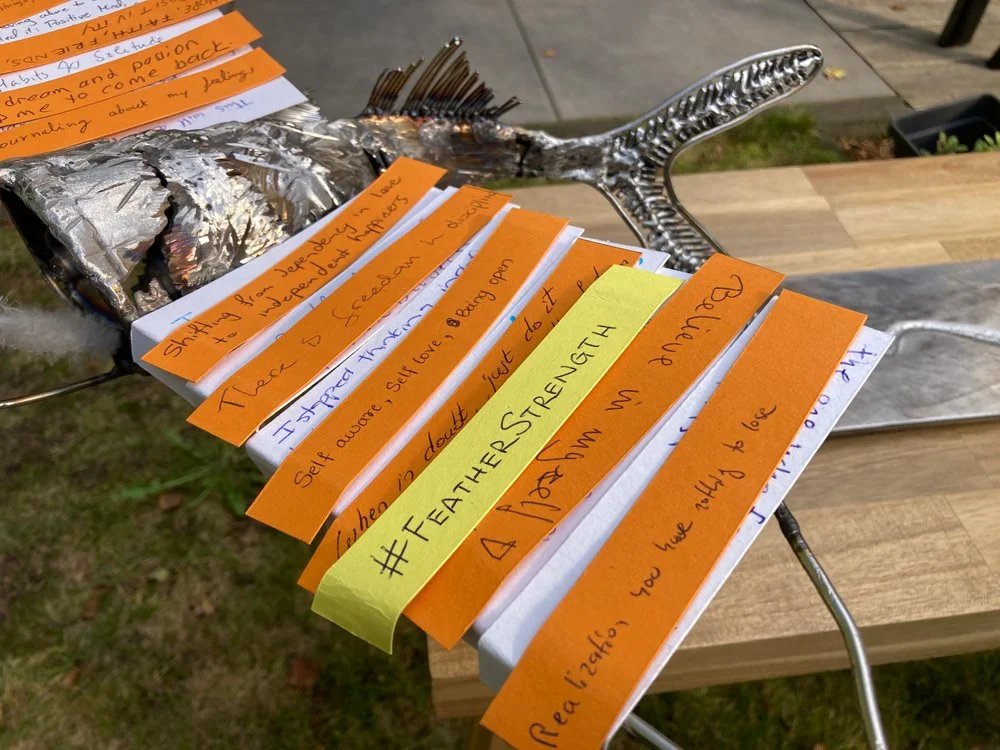 The Solidarity sculpture, a flying fish with wings of handwritten feathers